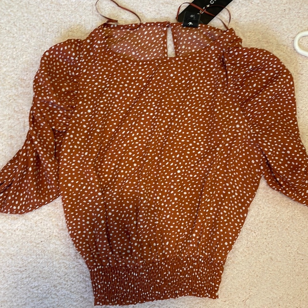 orange and white polka dot blouse